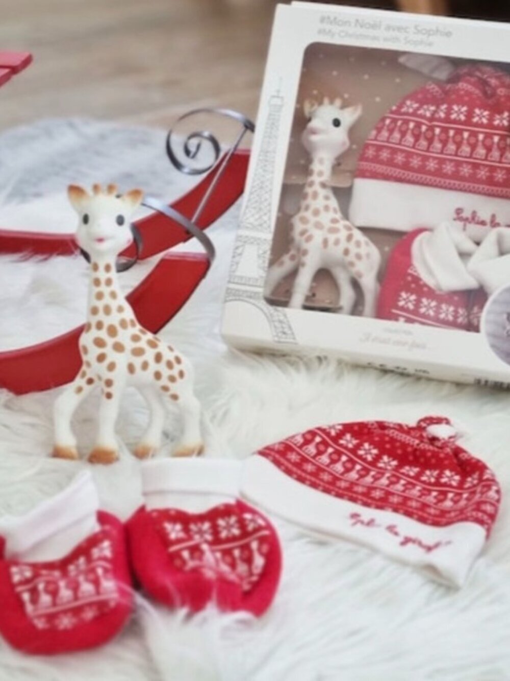 Sophie la girafe, a Christmas hat, and matching baby slippers New In Box
